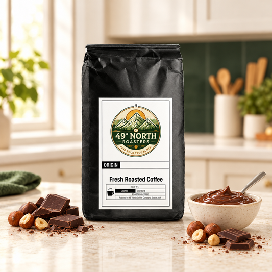 Chocolate Hazelnut coffee in a light kitchen with chocolate-hazelnut spread, hazelnuts and chocolate